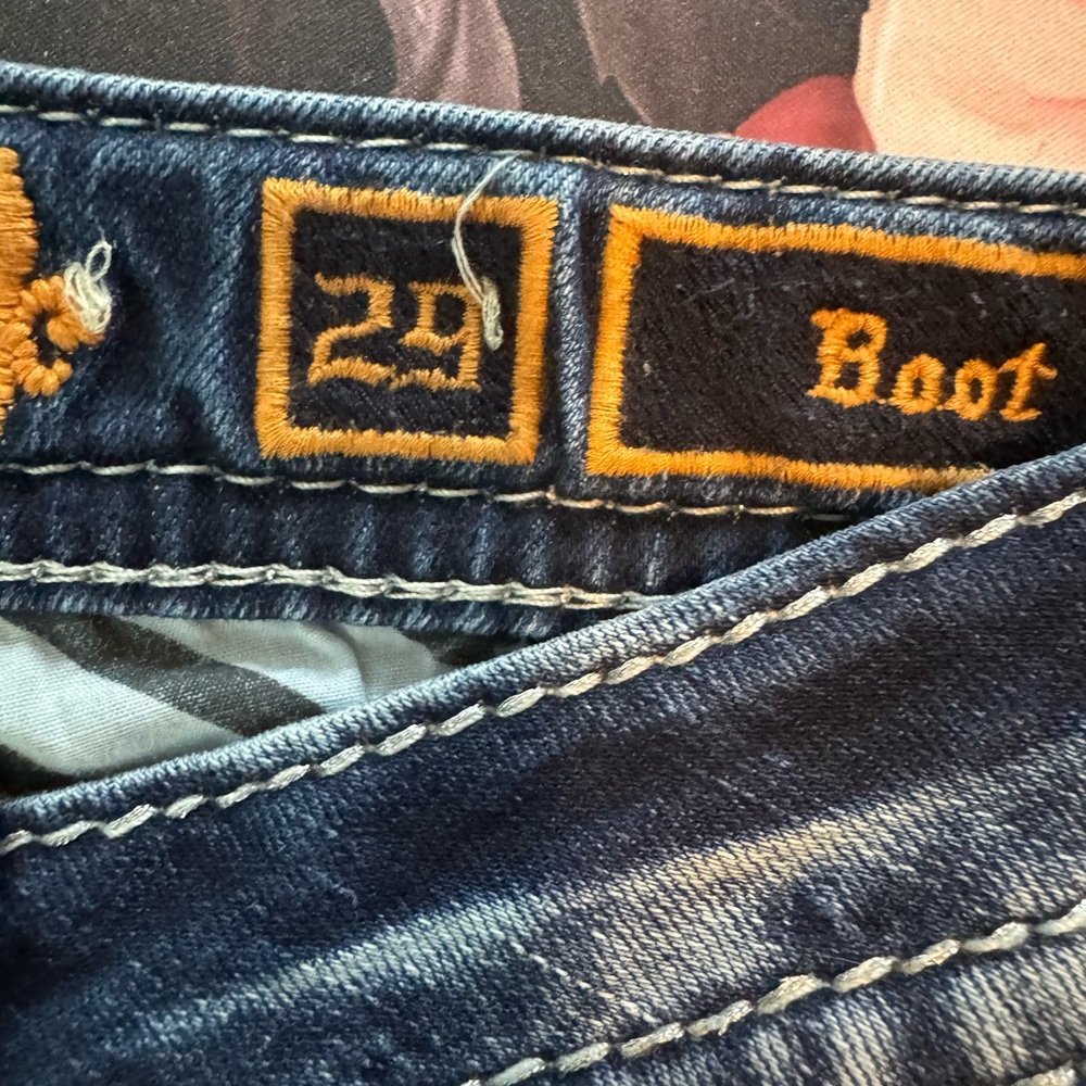 Size 29 boot cut rock revival jeans.